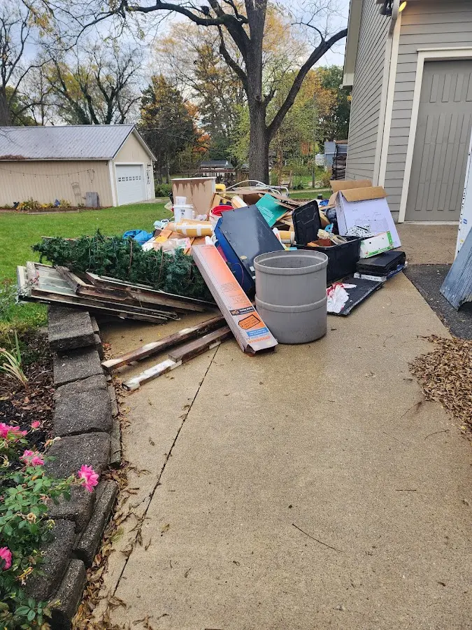 Dumpster being loaded with debris for 3 Yard Dumpster Rental in Harwich